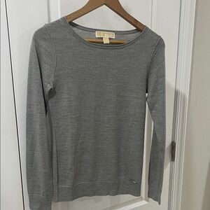 This is a Michael Kors gray crewneck sweater